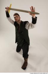 KEETA KNEELING POSE WITH SWORD